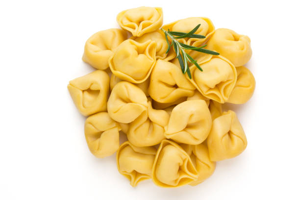 istock Raw homemade pasta,tortellini with herbs. 1372479943
