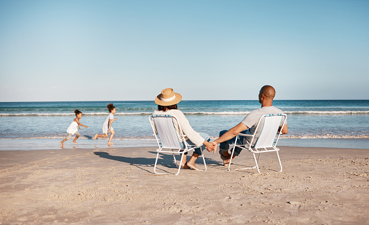 istock Shot of a family spending a day at the beach 1372480895