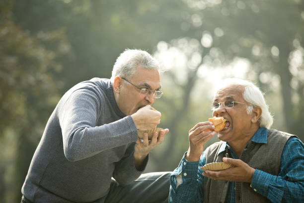 istock Two senior men having fun at park 1372481026