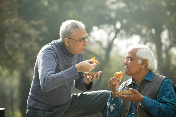 istock Two senior men having fun at park 1372481037