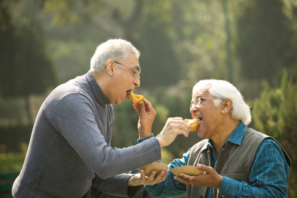 istock Two senior men having fun at park 1372481058
