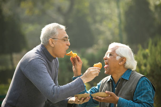 istock Two senior men having fun at park 1372481071