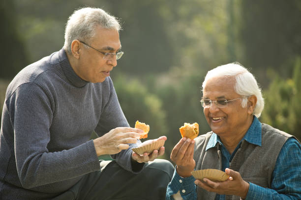 Two senior men having fun at park