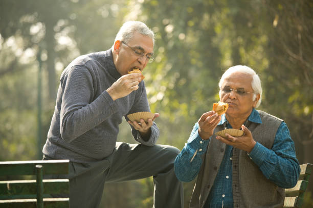 istock Two senior men having fun at park 1372481109