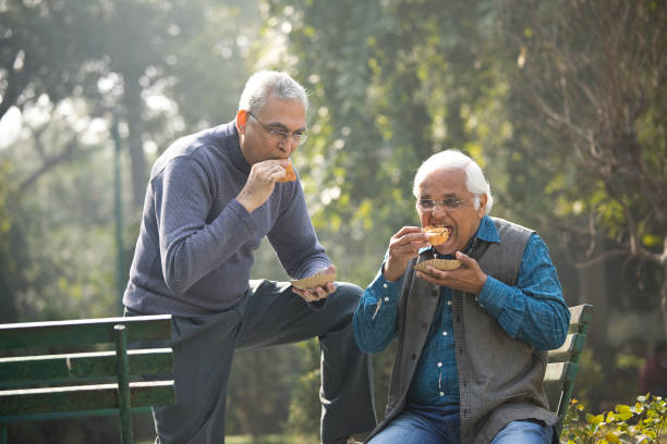 istock Two senior men having fun at park 1372481133