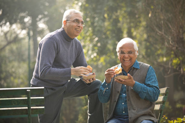 istock Two senior men having fun at park 1372481152
