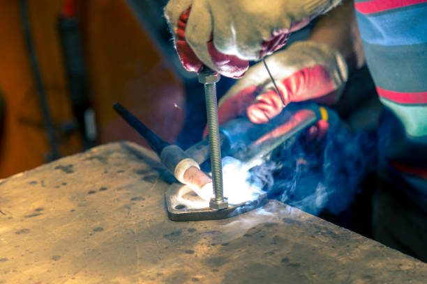 istock Welding the stainless steel stud to the flange 1372481218