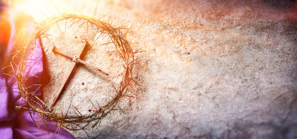 Passion And Crucifixion Of Jesus - Crown Of Thorns And Bloody Spikes And Purple Robe On Ground With Sunlight And Selective Focus Calvary Of Jesus - Crown Of Thorns And Bloody Nails And Violet Robe On Ground With Sunlight lent stock pictures, royalty-free photos & images