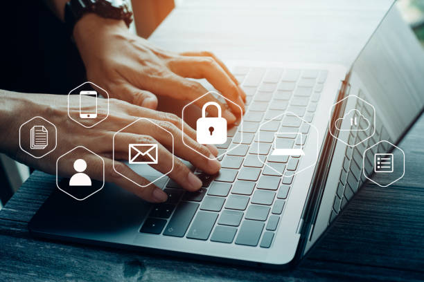 istock Businessmen protecting personal data on laptop and virtual interfaces 1372489490