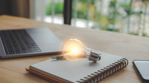 istock Bright lights bulb on a book. idea concept with innovation and inspiration. 1372489698