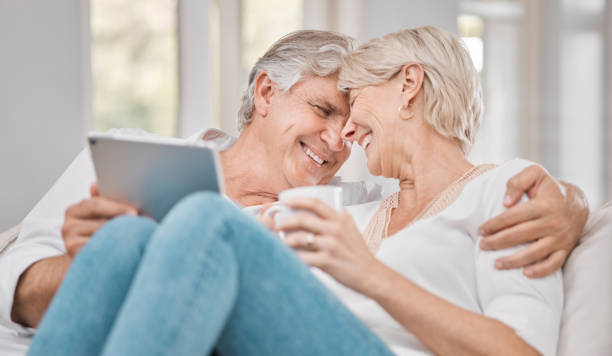 istock Shot of a elderly couple using a tablet at home 1372490831