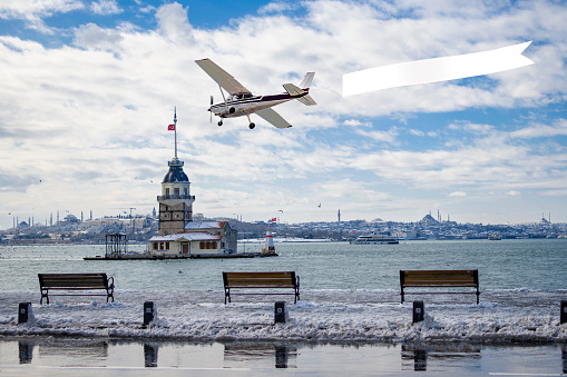 Airplane with banner to snowy day Istanbul Turkey
