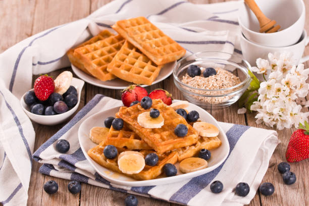 istock Waffles with blueberries, bananas and honey. 1372493638