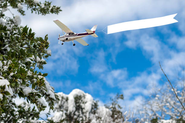 Airplane with banner to snowy day