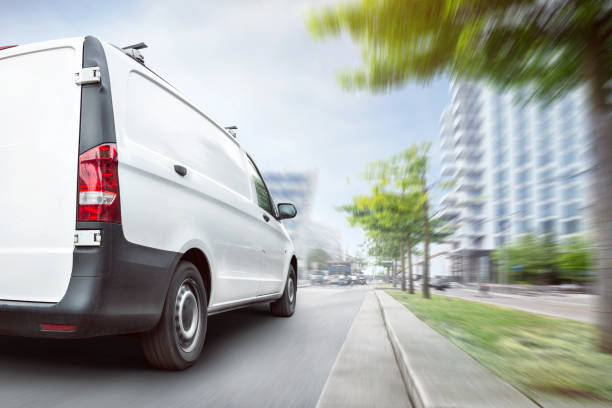 istock Fast delivery van driving in the city 1372495129
