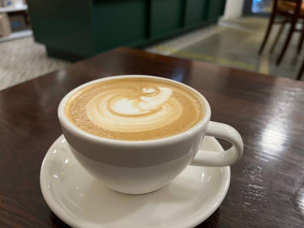 istock cup of cappuccino on a table 1372495943