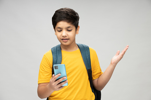 Photo of school boy wear yellow t-shirt backpack in background
