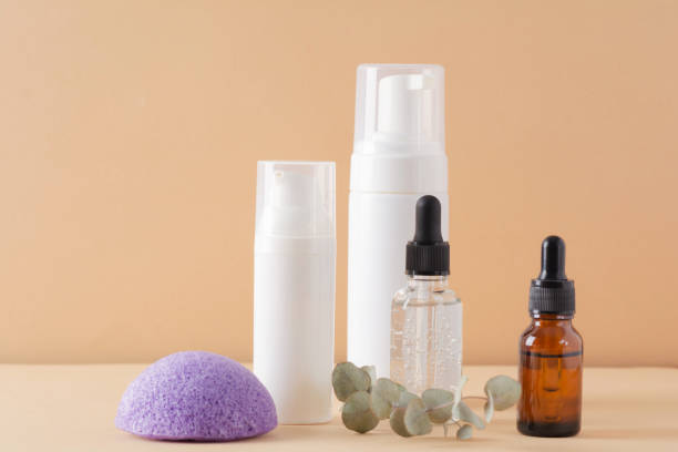 istock Facial cosmetic products and konjac sponge on a beige background 1372497247