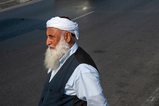 Istanbul, Turkey - September 21, 2011: An old man in a turban in Eminönü