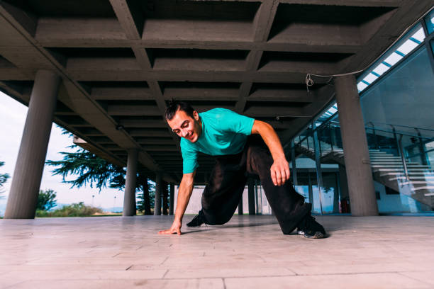 istock Caucasian man practicing parkour at urban place 1372503700