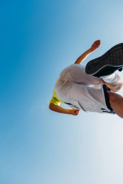 istock Young parkour man jumping in skatepark 1372503763