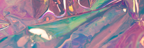 istock Pink glowing defocused hologram banner. Crumpled foil texture. 1372508227