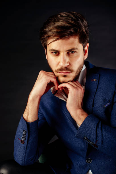 istock Handsome young man on dark background 1372512416