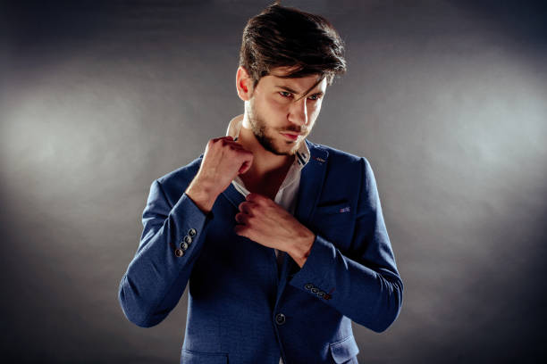 istock Handsome young man on dark background 1372512431