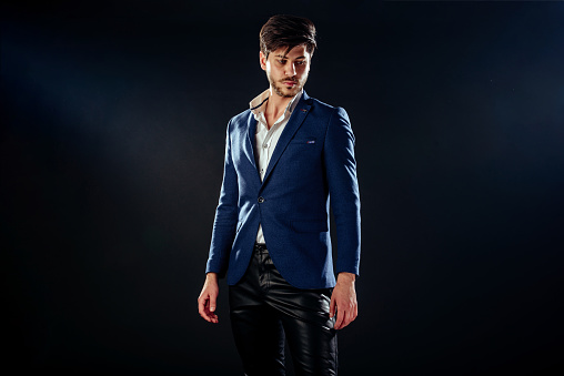 Fashion sexy model man portrait isolated on black background