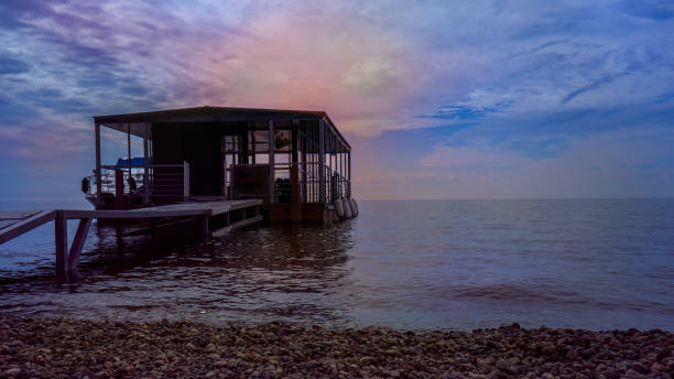 istock Marine wooden pier at sunset 1372514671