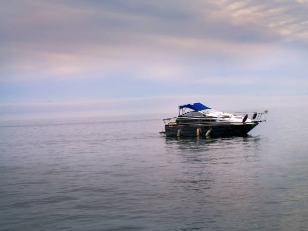 istock Boat at the sea during sunset 1372514737