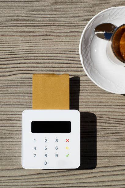 istock using a credit card in a sidewalk cafe 1372518341