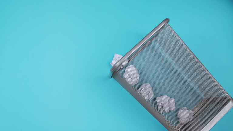 Empty Office Trash Basket Filles Up With Waste Papers.