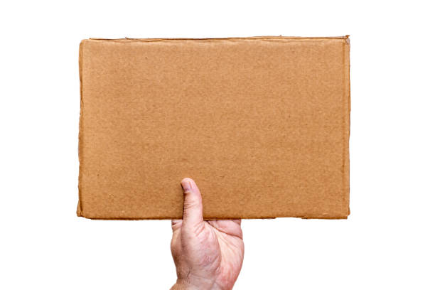 istock Hand holding a cardboard sign without any captions from the bottom. 1372521077
