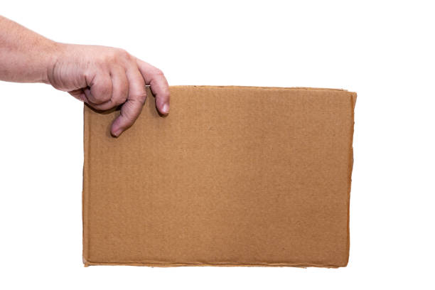 istock Hand holding a cardboard sign without any legend from the side. 1372521163
