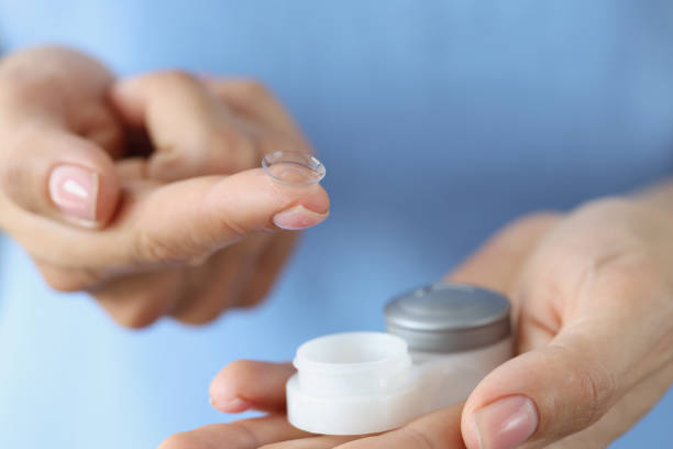 istock Contact lenses for vision and a container in female hands, blurry 1372522626