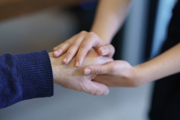 istock Doctor holding patient's hand. 1372522786
