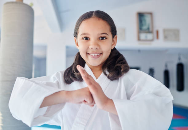 istock Shot of a cute little girl practicing karate in a studio 1372525977