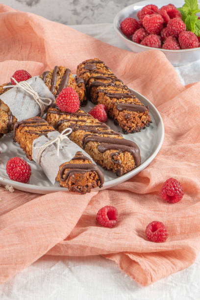 istock Cereal bars with raspberries on kitchen counter top. 1372526689