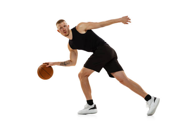 istock Young muscled man, basketball player practicing with ball isolated on white studio background. Sport, motion, activity concepts. 1372526784