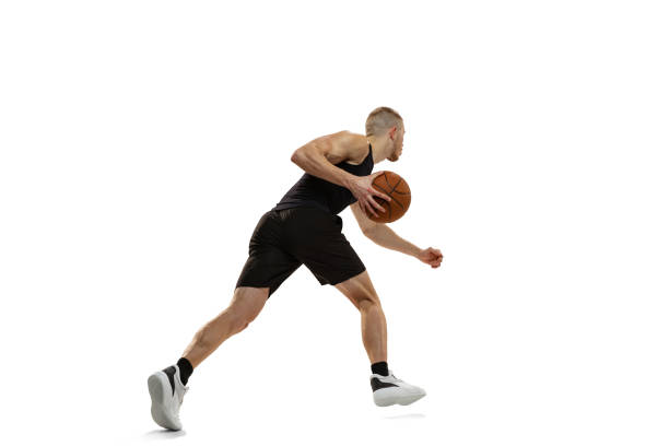 istock Young muscled man, basketball player practicing with ball isolated on white studio background. Sport, motion, activity concepts. 1372526787