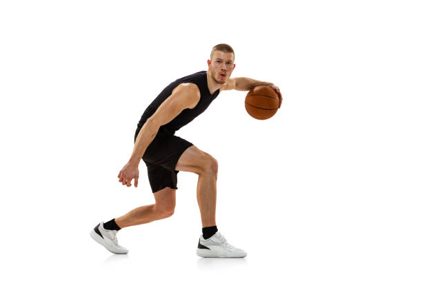 istock Young muscled man, basketball player practicing with ball isolated on white studio background. Sport, motion, activity concepts. 1372526788