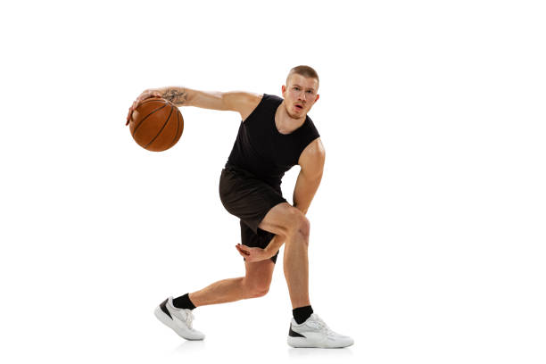 istock Young muscled man, basketball player practicing with ball isolated on white studio background. Sport, motion, activity concepts. 1372526793