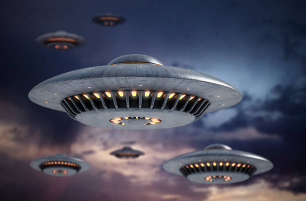 istock Group of retro UFO's hovering in the sky 1372527308
