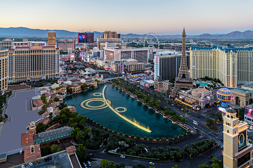 The famous Las Vegas Strip with the Bellagio Fountain. The Strip is home to the largest hotels and casinos in the world.