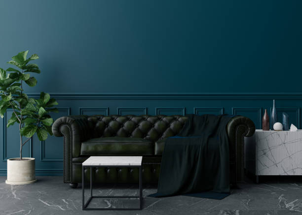 istock Empty blue wall in modern living room. Mock up interior in classic style. Free space, copy space for your picture, text, or another design. Leather sofa, plant, sideboard. 3D rendering. 1372528729