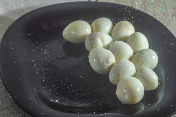 istock Fresh Quail Eggs cooked,placed on a black dish with salt 1372529136