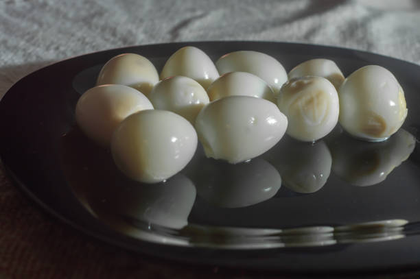 istock Fresh Quail Eggs cooked,placed on a black dish with salt 1372529140