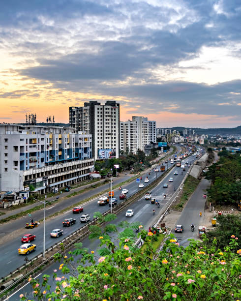 Traffic flow on a highway with nice evening sky in the background. Pune,Maharashtra, India - January 9th, 2022:Traffic flow on a highway with nice evening sky in the background. pune photos stock pictures, royalty-free photos & images