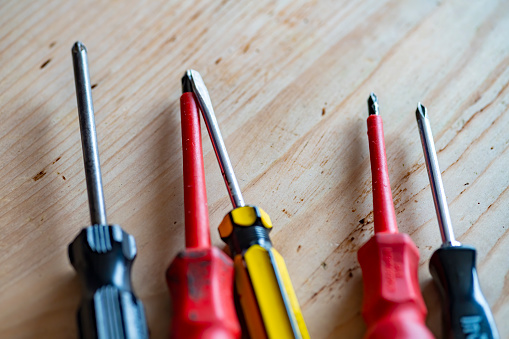 A group of Philips, cross head and flat head screwdrivers.